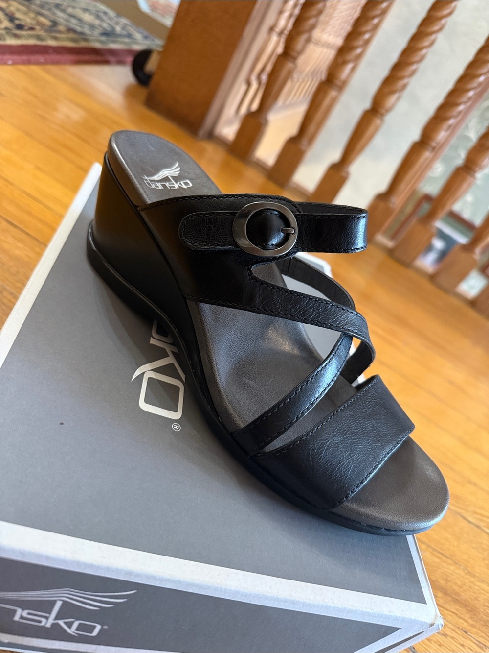 Dansko Black Leather Wedge Slide Sandal with Buckle Accent